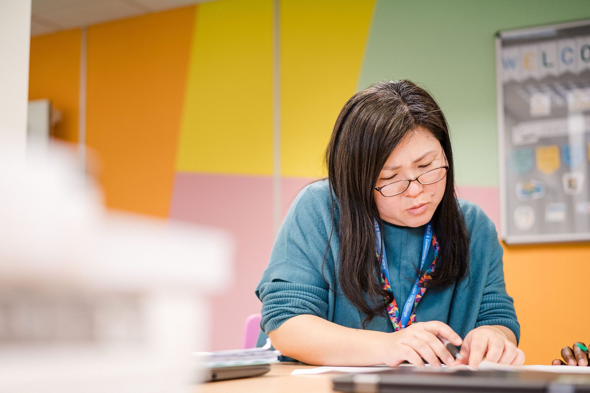Adult student in Enfield studying and taking notes
