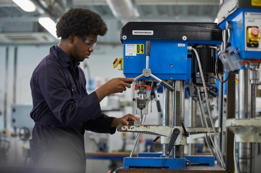 LCC Engineering student working milling a steel bar