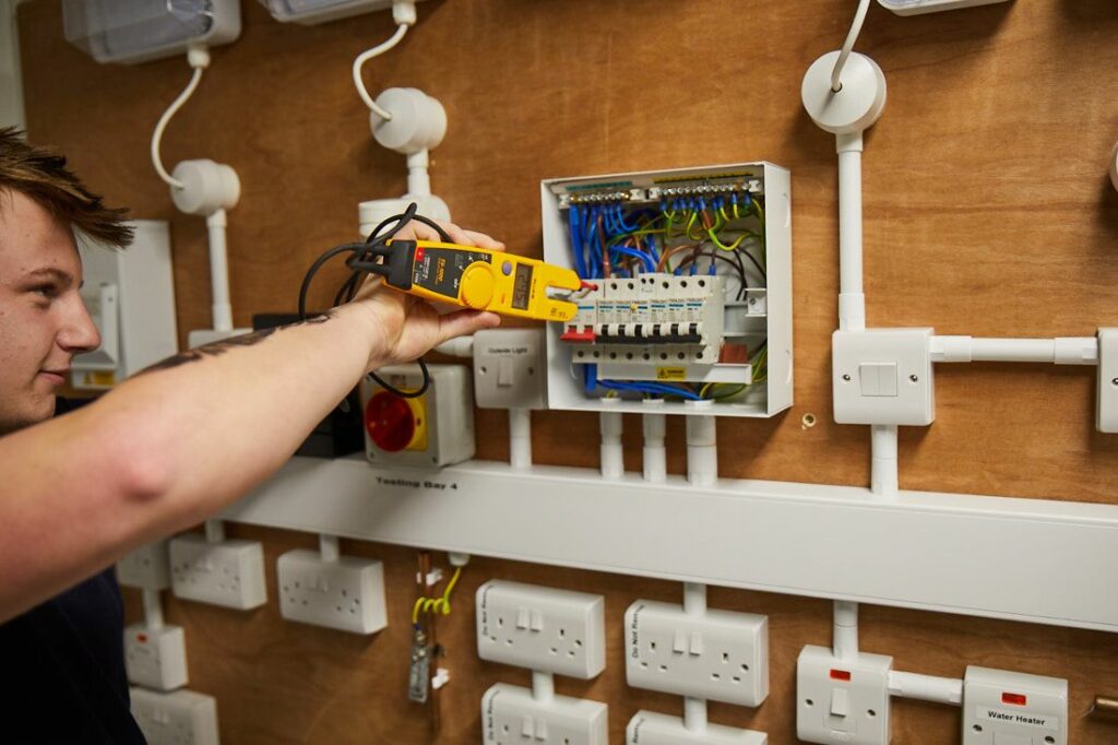 Engineering Student doing an Electrician course and testing the wiring