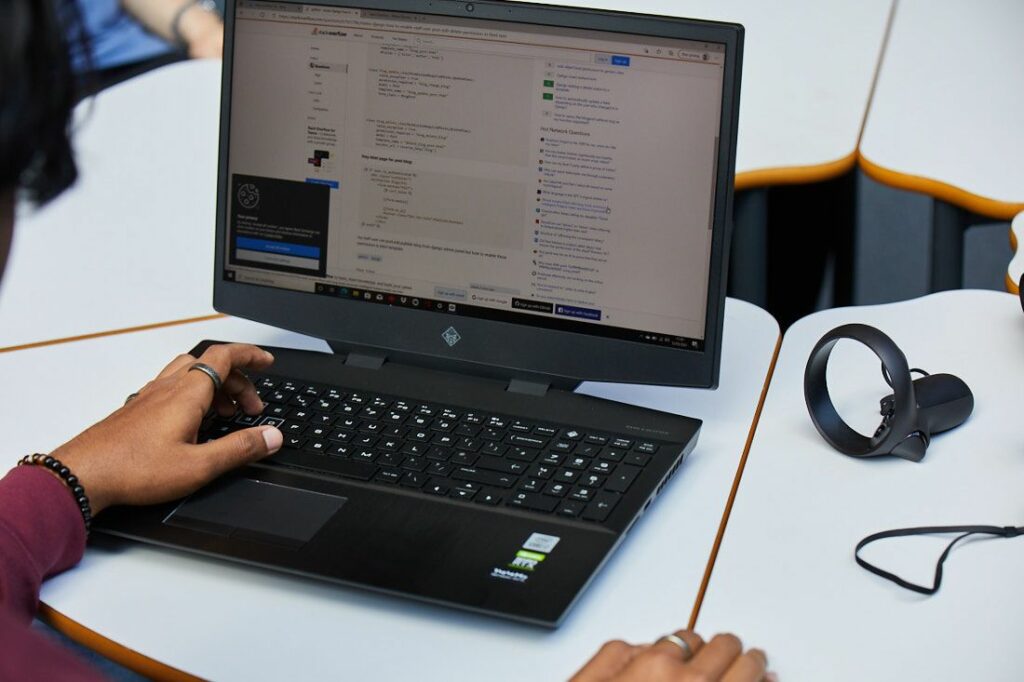 Digital and IT students testing code that has been written for making software
