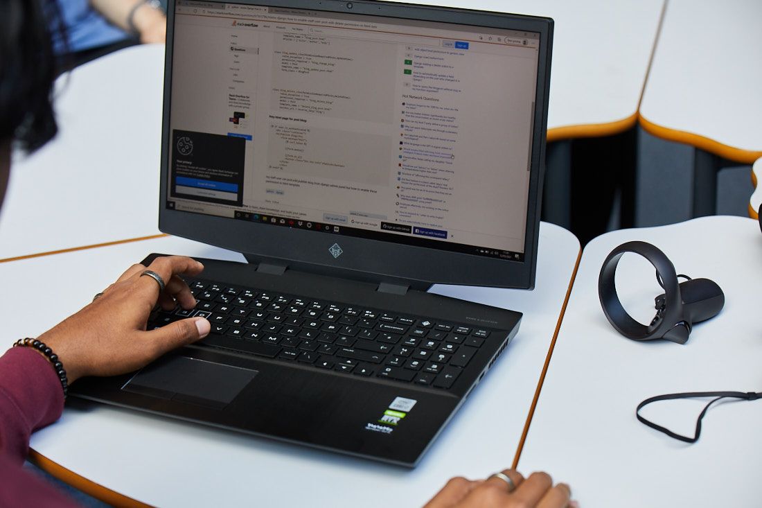 Digital and IT students testing code that has been written for making software