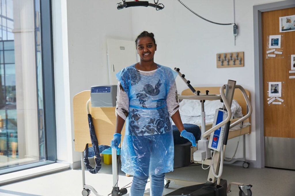 Social Science student in a healthcare ward wearing protective gear