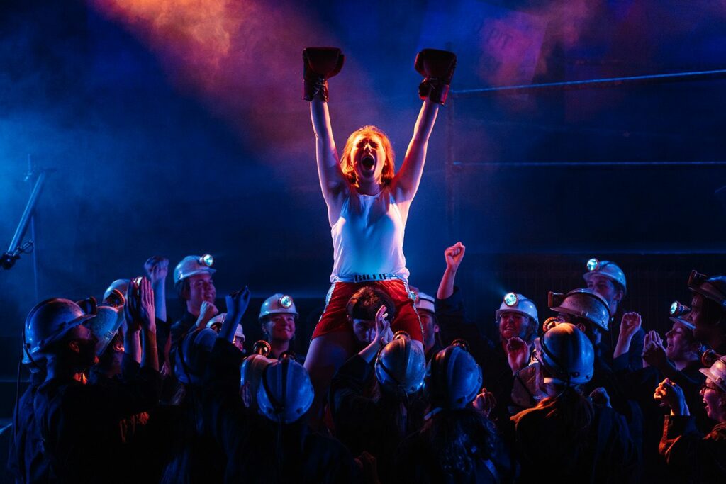 LCC Creative arts performing a show with a boxer being cheered on by crowds
