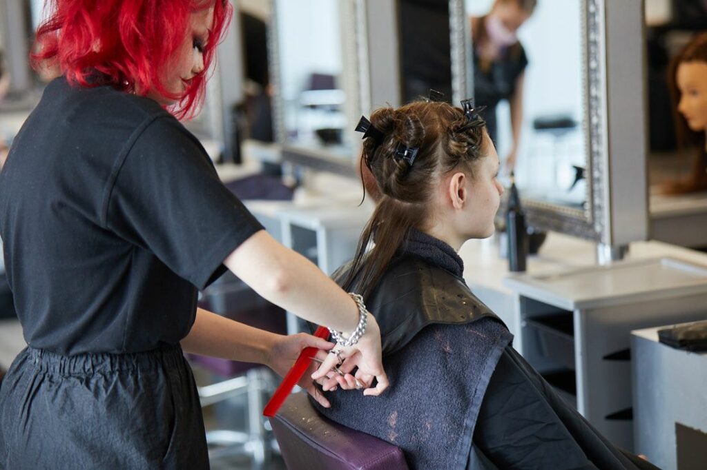 LCC Hair and Beauty student cutting a female clients hair