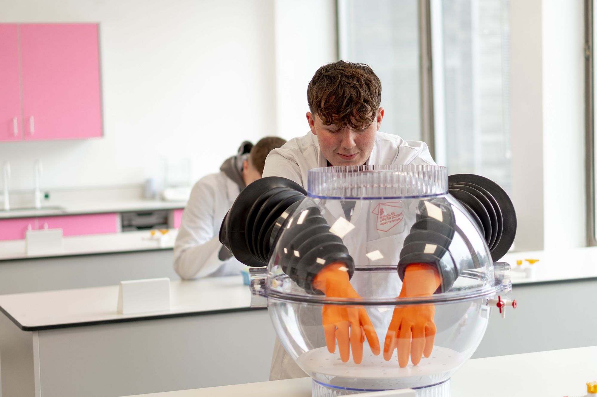 LCC Applied Science student conducting an experiment wearing safety gear