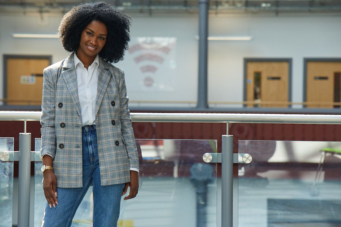 LCC Business student standing in the Red Print room in the Printworks campus