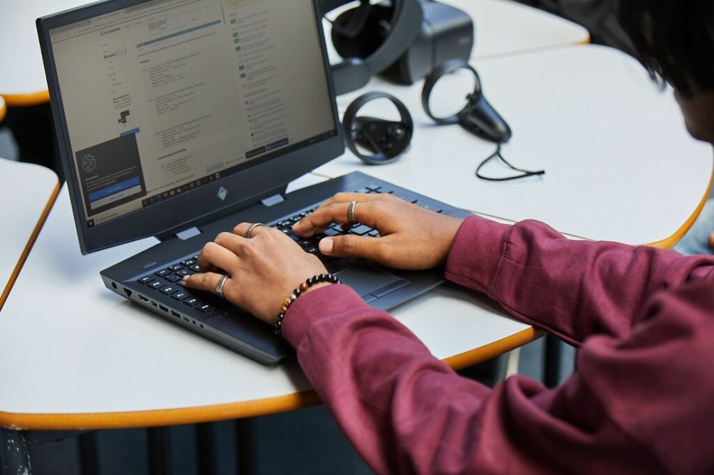 Digital and IT students testing code that has been written for making software