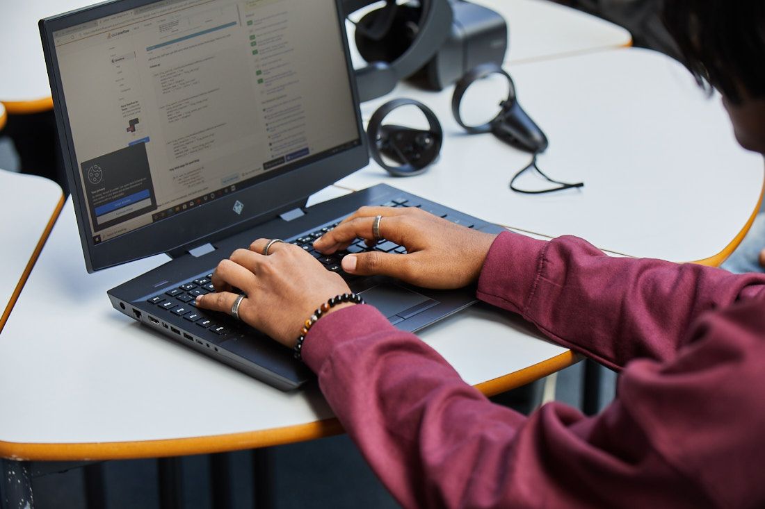 Digital and IT students testing code that has been written for making software