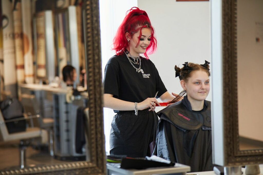 LCC Hair and Beauty student cutting a clients hair