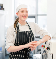 Student posing in the kitchen