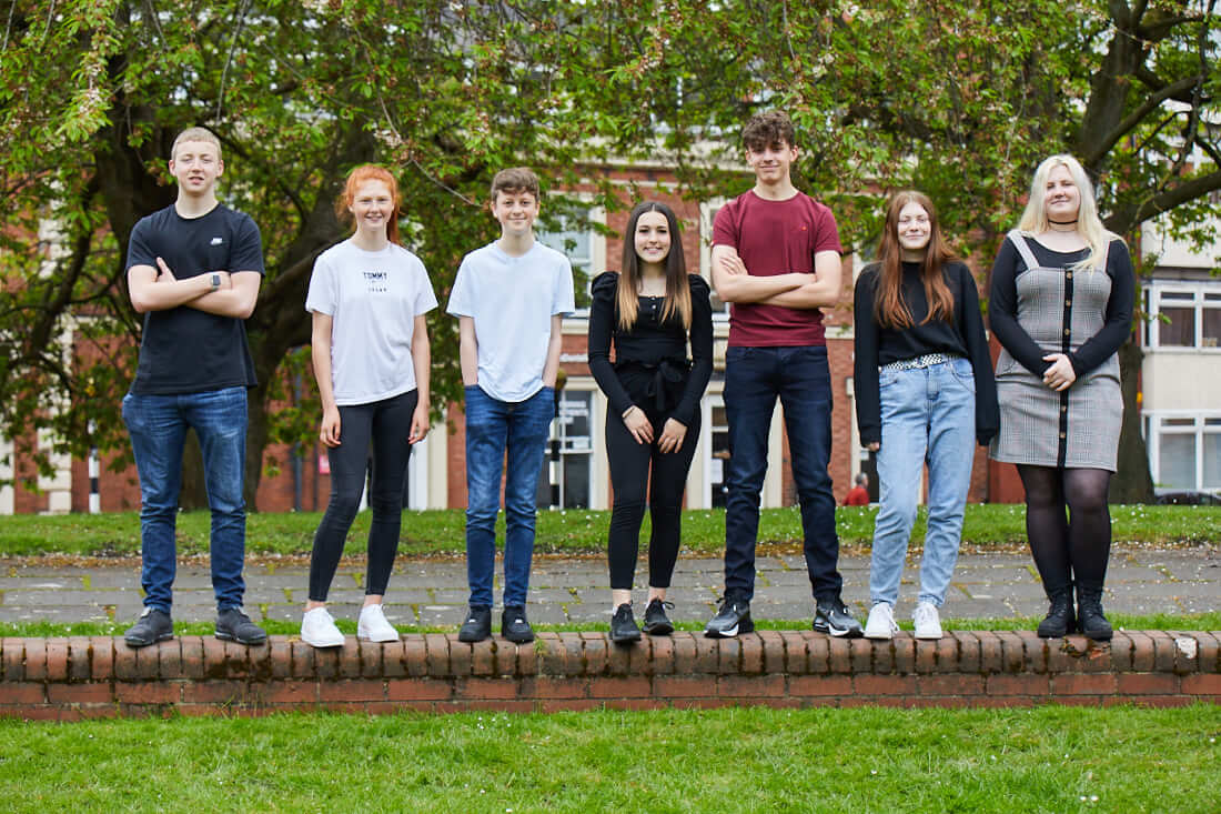 Group of 14+ Academies students stood outside smiling