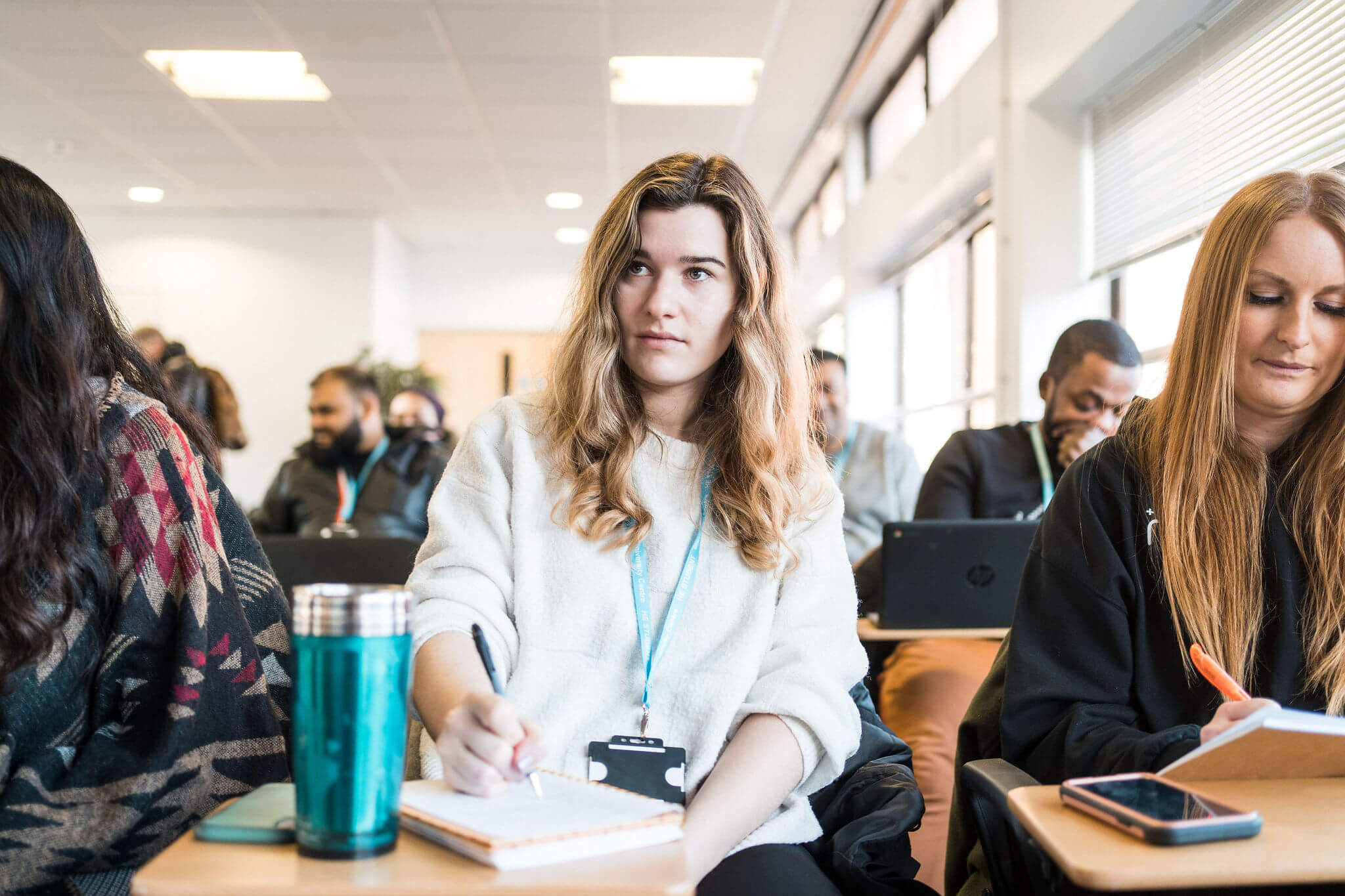 A group of higher education students sitting