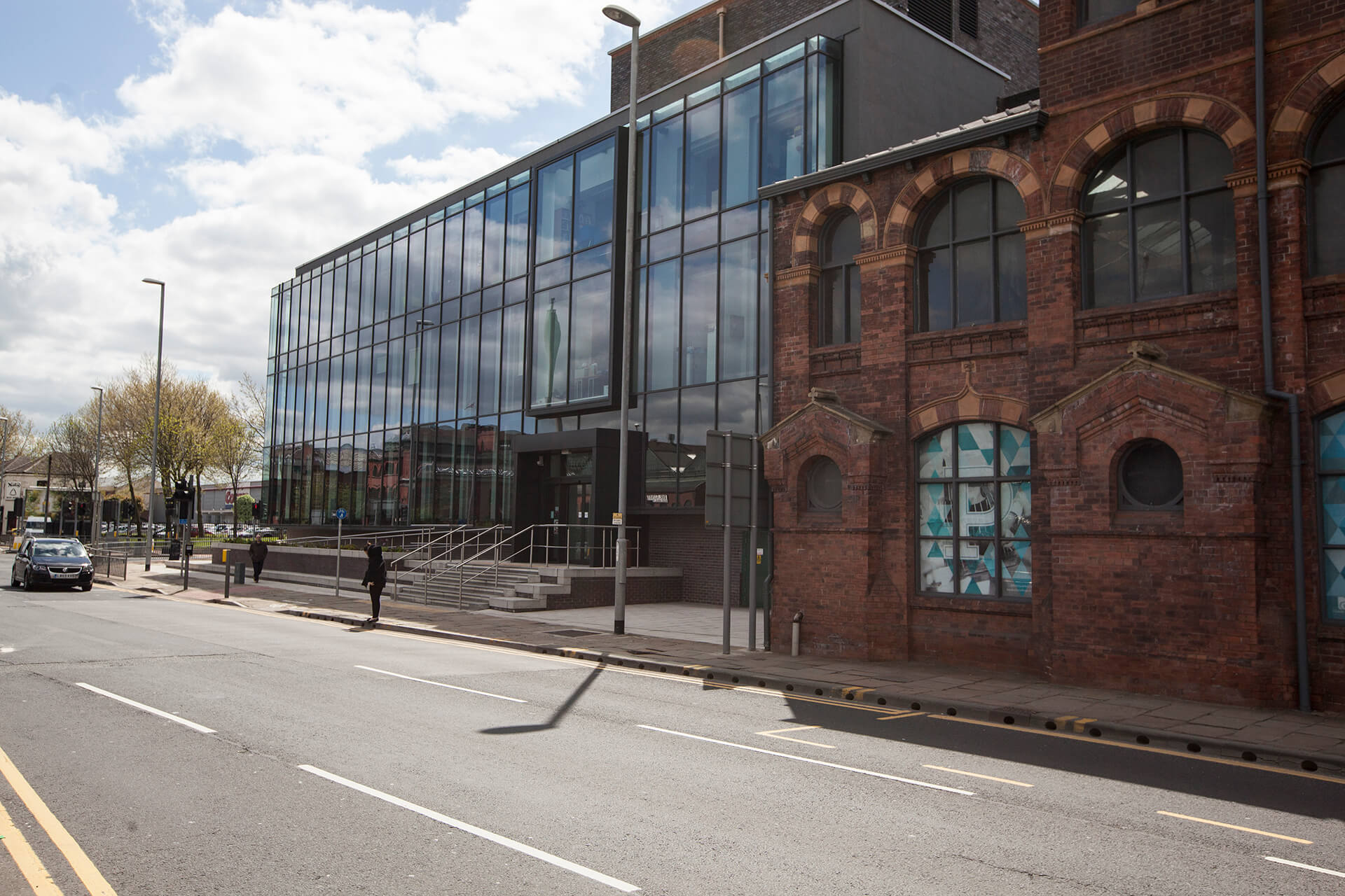 Glass building front entrance of Printworks Campus