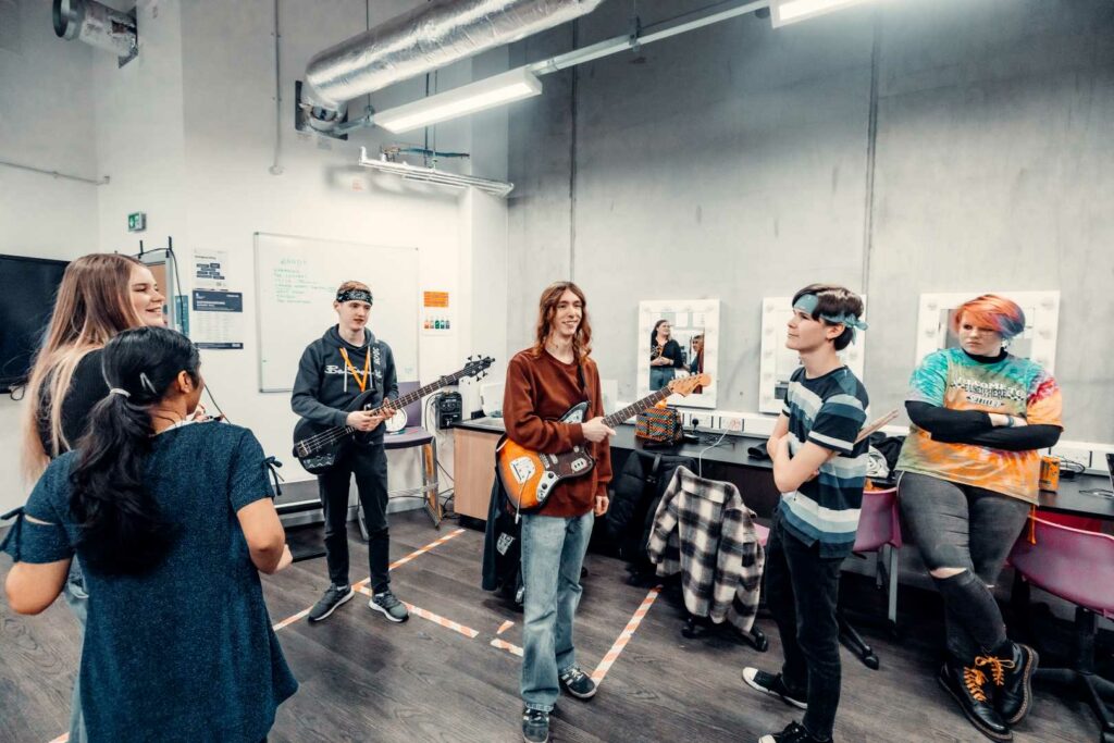 Behind the scenes photo of a band getting ready to go out on stage