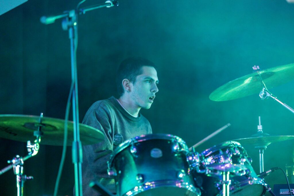 Creative Arts music student drumming for a live show