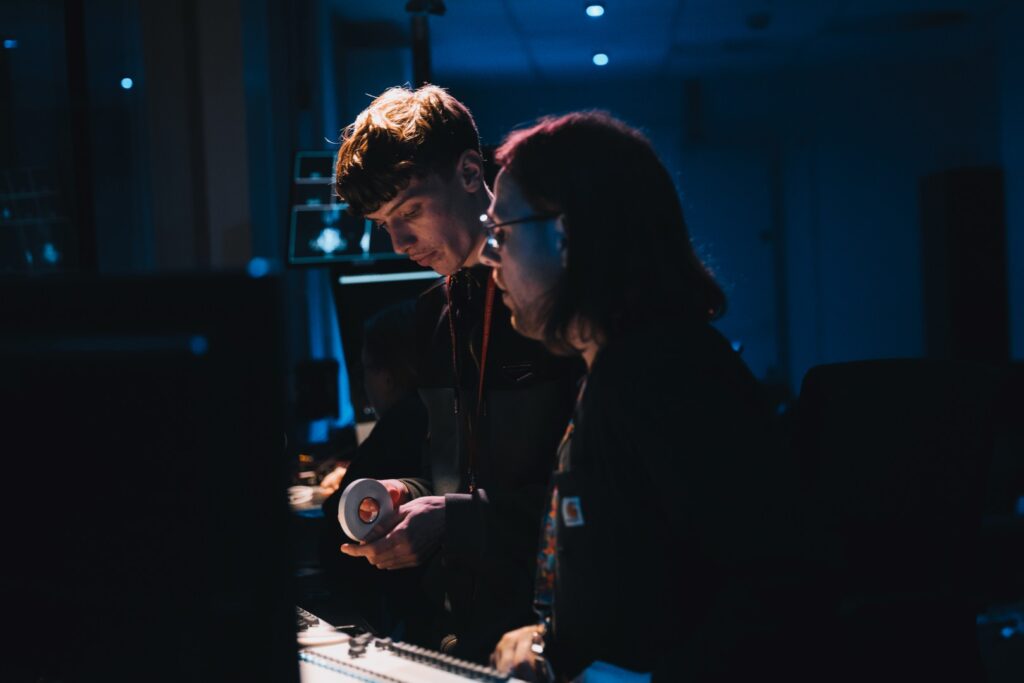 Two audio engineers providing the mixing for the live shows