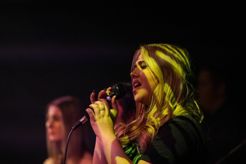 Female singers performing at a show
