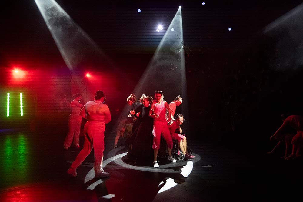 Leeds City College Creative Arts Performing Arts group of students acting in spotlight on stage