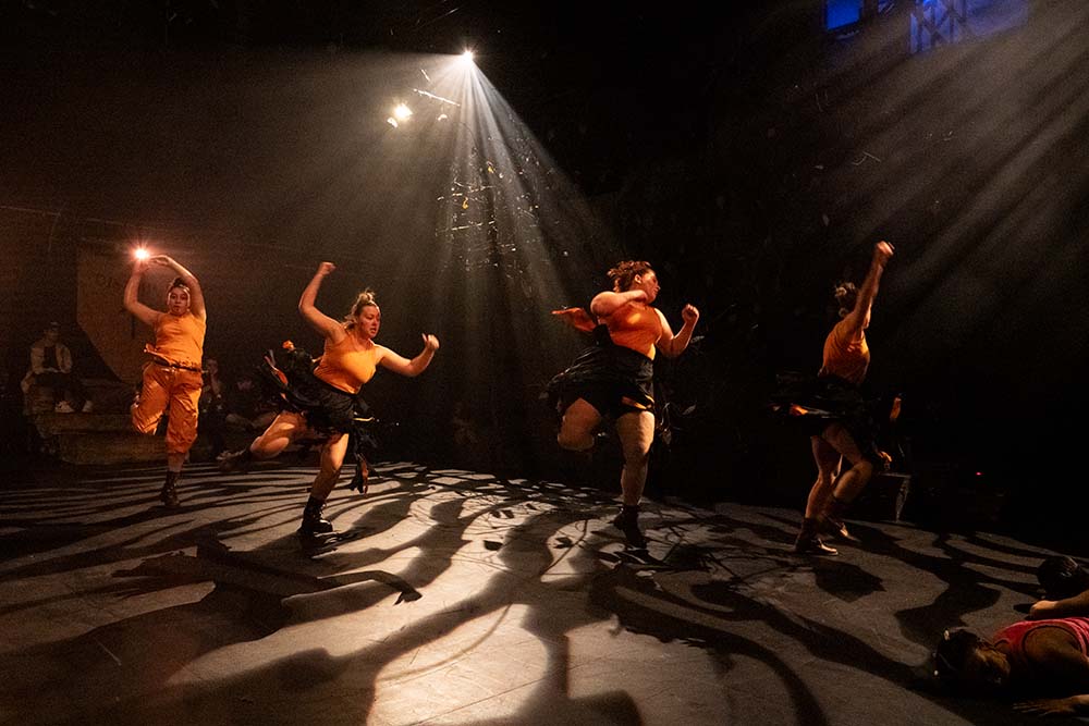 Group of Creative Arts students performing a dance on stage