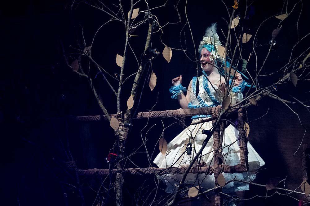 Leeds City College Creative Arts Performing Arts student acting as Hunger Games Queen on stage