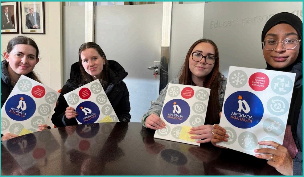 Four Leeds City College students sat holding certificates from the Academia Igualada in Spain